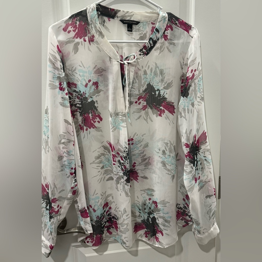 Sheer multi colored top, string tie at top. 100% polyester.